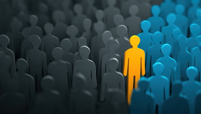 A Vibrant Individual Stands Out From The Crowd Representing Uniq