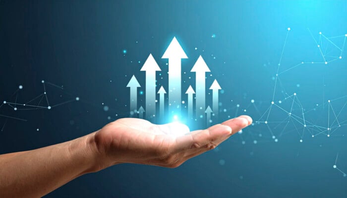 Glowing Digital Arrows In Hand Representing Business Progress And Financial Growth With Business Investment Strategy