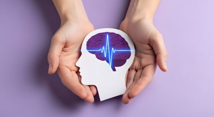 Mental Health Care Concept. Hands Holding Paper Head With Brain