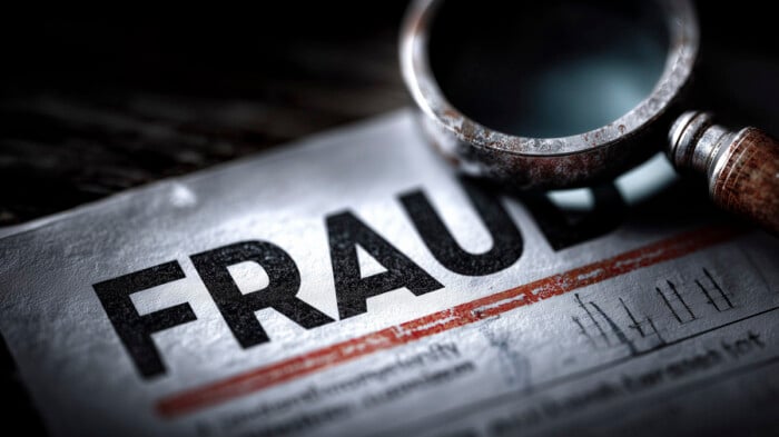 Magnifying Glass On Fraud Document For Investigative Research, C