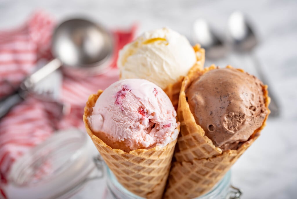 Strawberry, Vanilla, Chocolate Ice Cream With Waffle Cone On Marble Stone Backgrounds