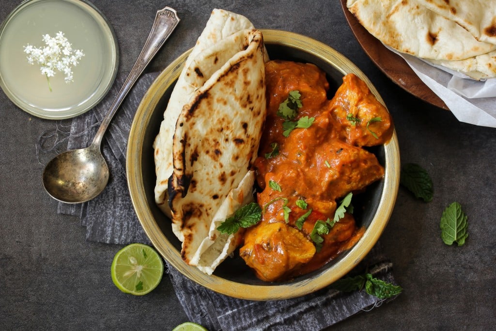 Butter Chicken Served With Homemade Indian Naan Bread