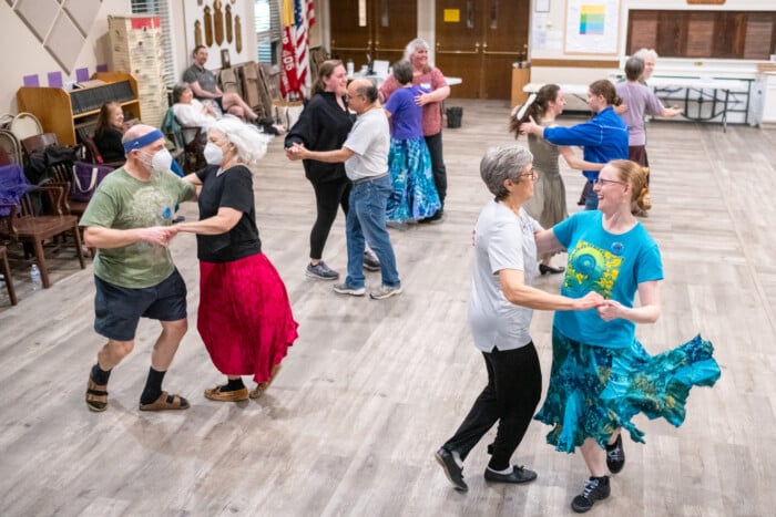 A Group Of Contra Dancers Having A Good Time..