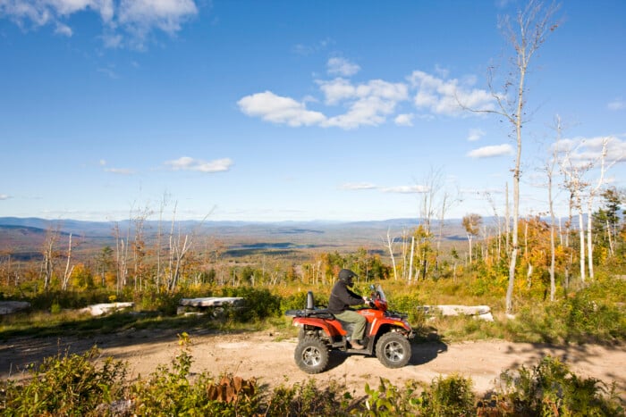 A Man Rides His Atv On A Ridge At Jericho Mountain State Park In Berlin, New Hampshire. White Mountains.