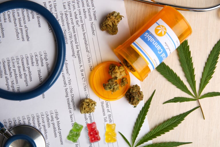 Medical Prescription With Dry Cannabis On Table Close Up