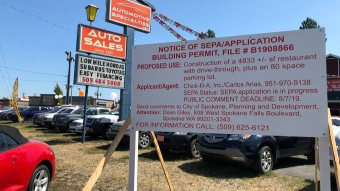A Chick-Fil-A building permit sits along Newport Highway in north Spokane. Could the chicken chain finally be coming to Spokane? 