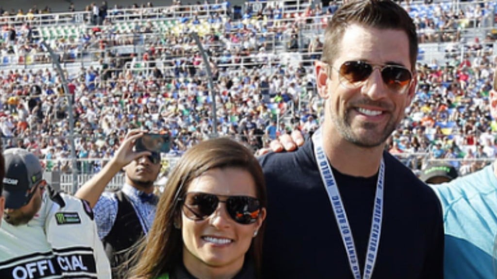 Aaron Rodgers and Danica Patrick show off some major PDA