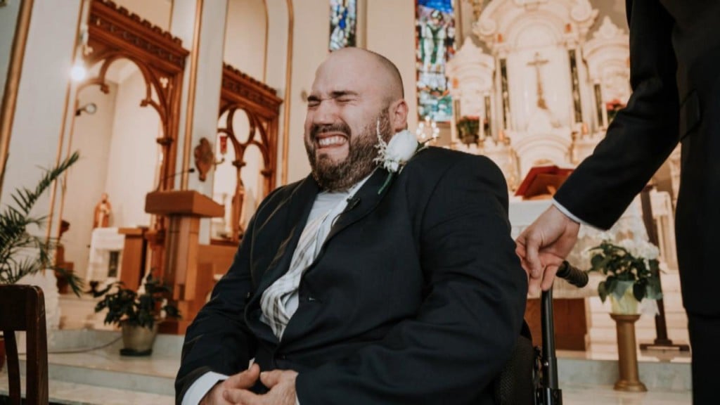 Groom in wheelchair sobs as he sees his wife at wedding