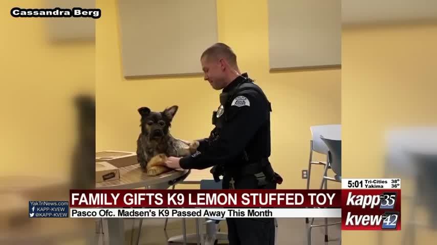 Family gifts K9 Lemon stuffed toy to Pasco officer