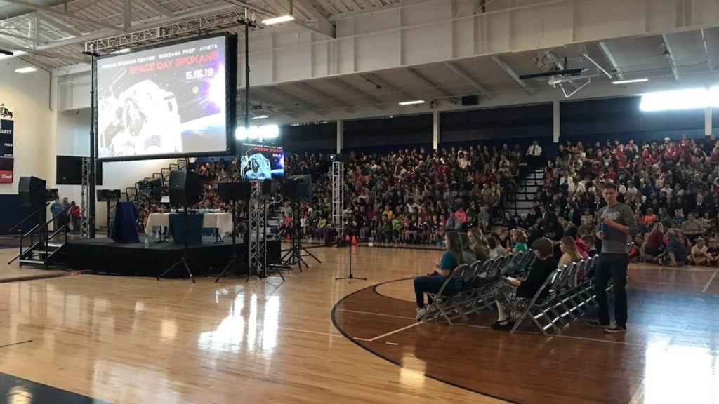 Astronaut Anne McClain speaks to local students from the International Space Station