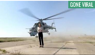 Brave journalist reports from Military helicopter runway