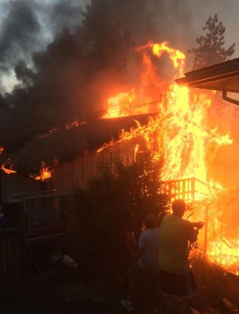 Woman, dog survive house fire in Liberty lake