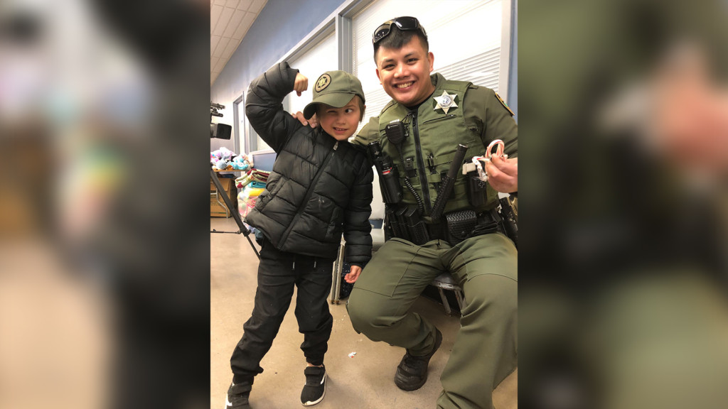 Officers, firefighters take local kids shopping during Holidays and Heroes event