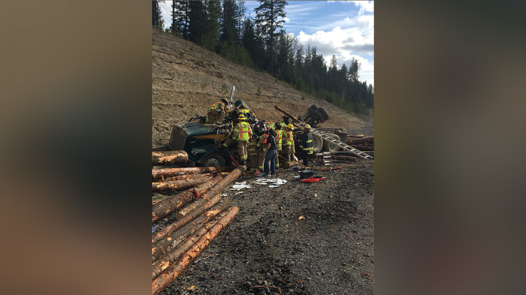 Log truck overturns on US 95, driver taken to hospital