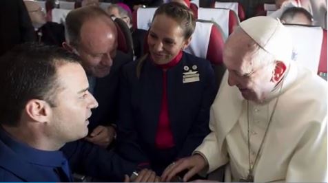 Pope Francis performs mid-air wedding ceremony for flight attendants on plane