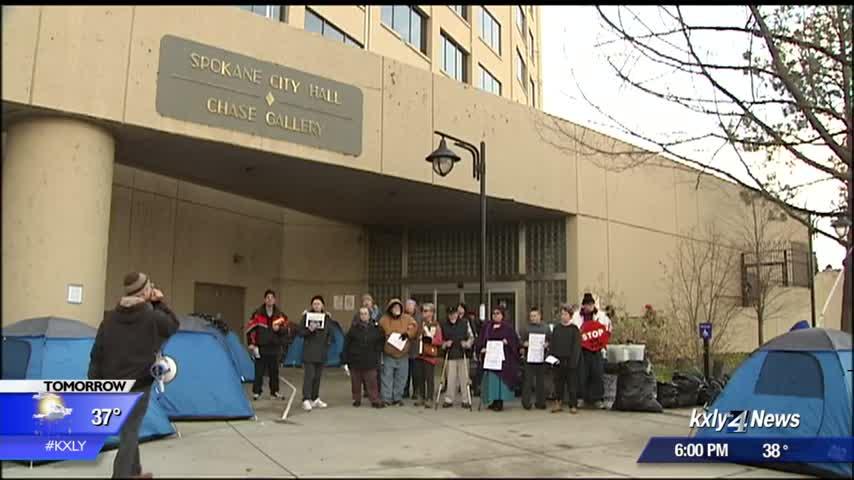 Protesters gather outside city hall, council says shelter beds are on the way