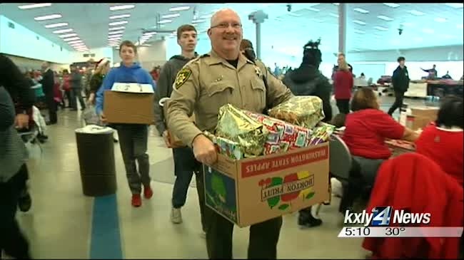 Deserving kids shop for the holidays with local heroes