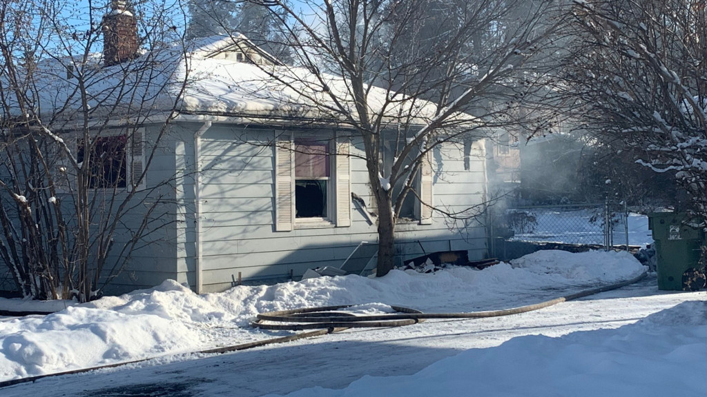 Firefighters clear out a house fire on 16th Avenue.