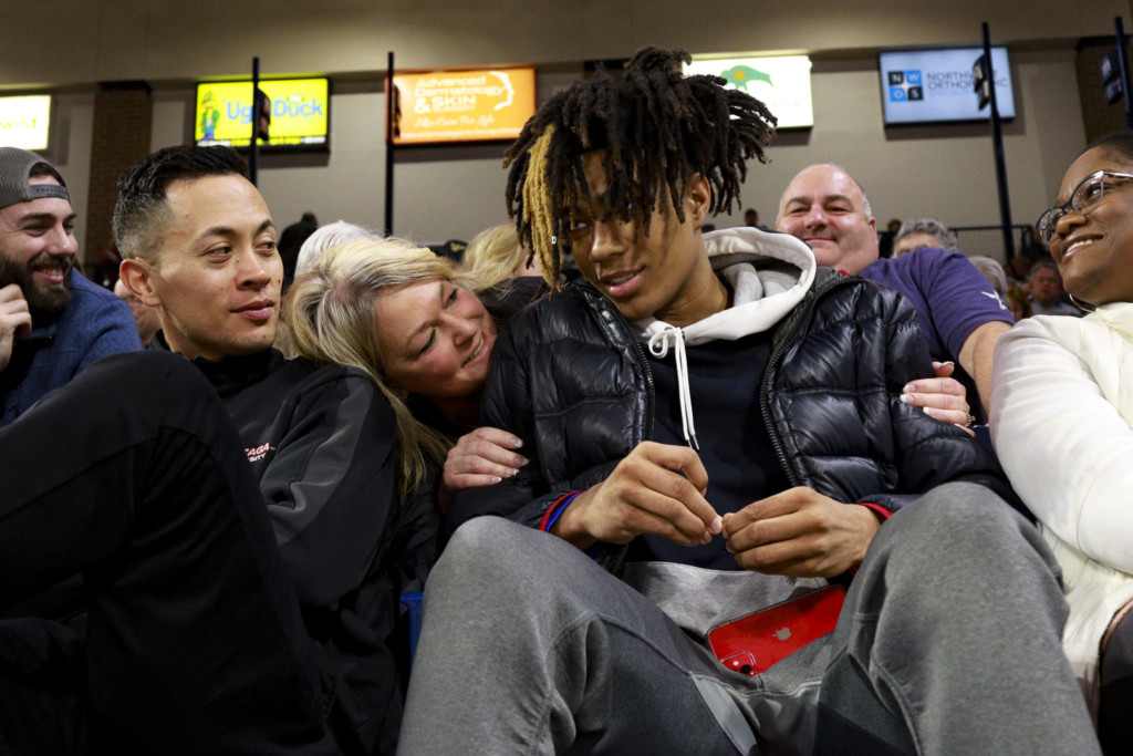 4-star Guard Hunter Sallis listens to a Gonzaga fan while watching the game against Pacific.