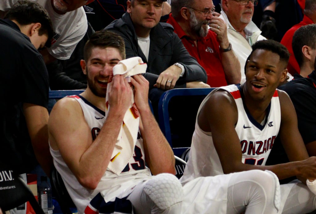 Gonzaga's Killian Tille and Joel Ayayi share a laugh on the bench during the game against Pacific. Gonzaga won 92-59.