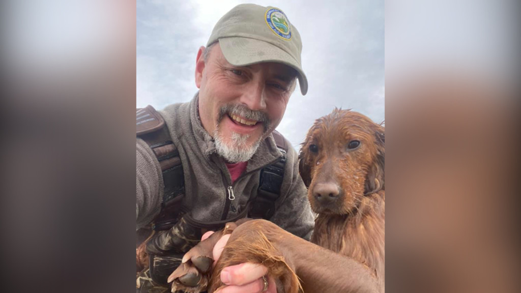 Eric Braaten with the dog he rescued.