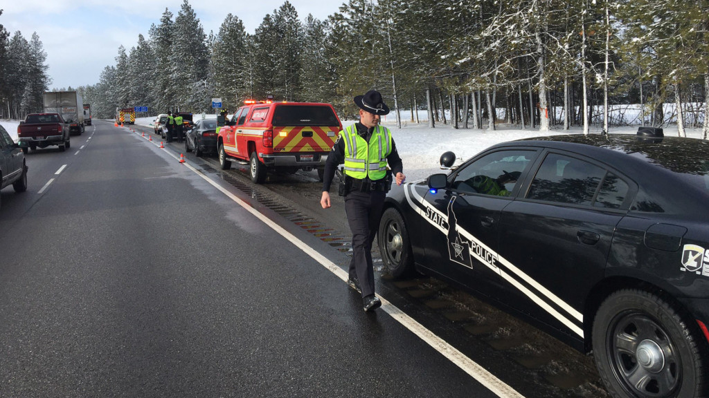 ISP Troopers are parked along the shoulder of westbound I-90 to investigate a crash.