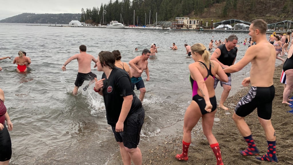 People brave cold water at Lake Coeur d'Alene