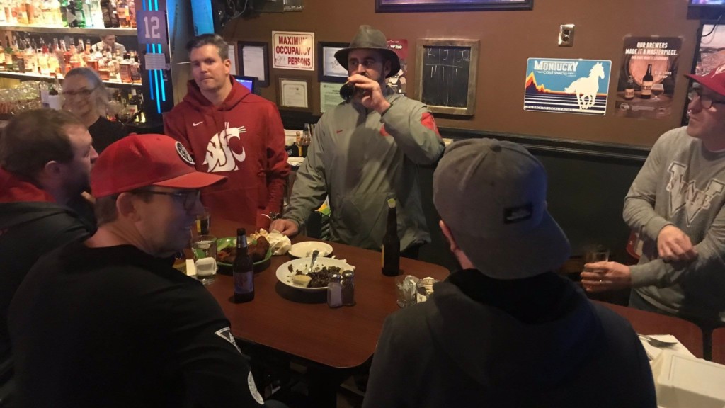 WSU football coach Nick Rolovich treats fans to a round of beers.