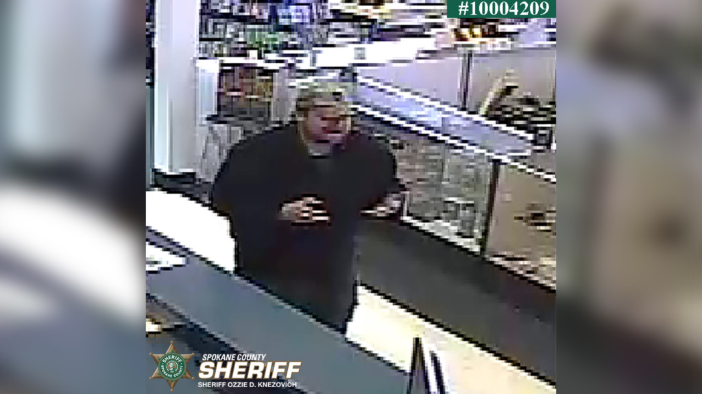 Security footage from the pawn shop, showing the suspect.