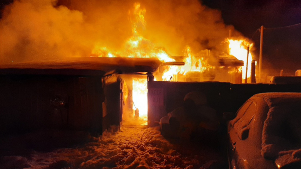 A house engulfed in flames in Weippe.