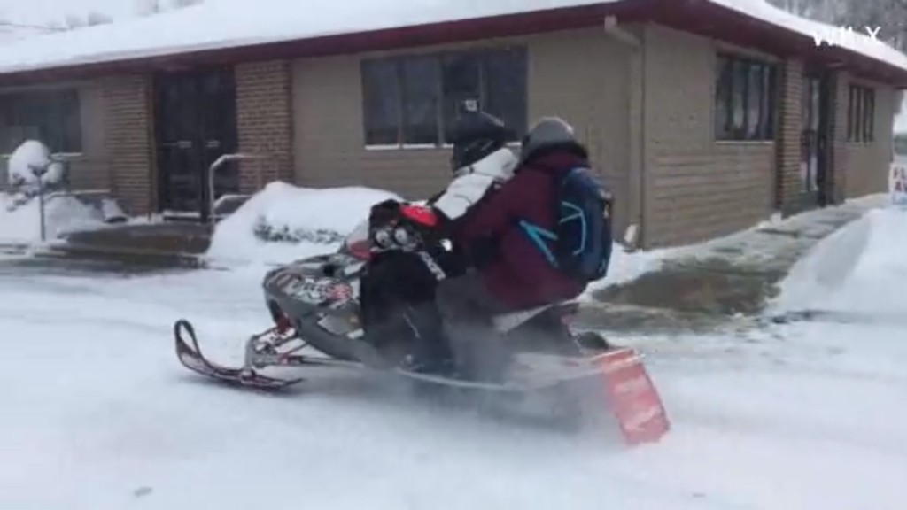 Michigan pharmacist uses snowmobile to deliver medicine