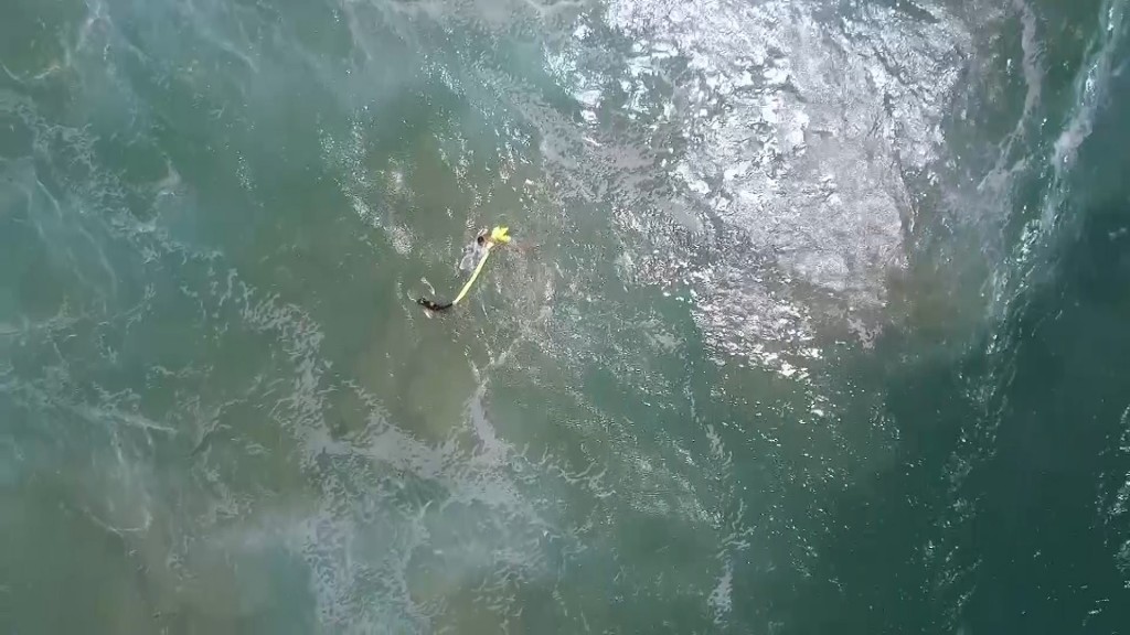 Drone rescues swimmers by dropping inflatable pod
