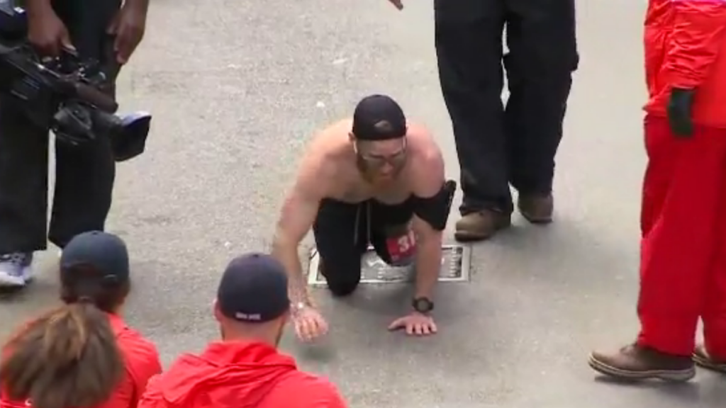 Marine crawls to finish line of Boston Marathon to honor comrades