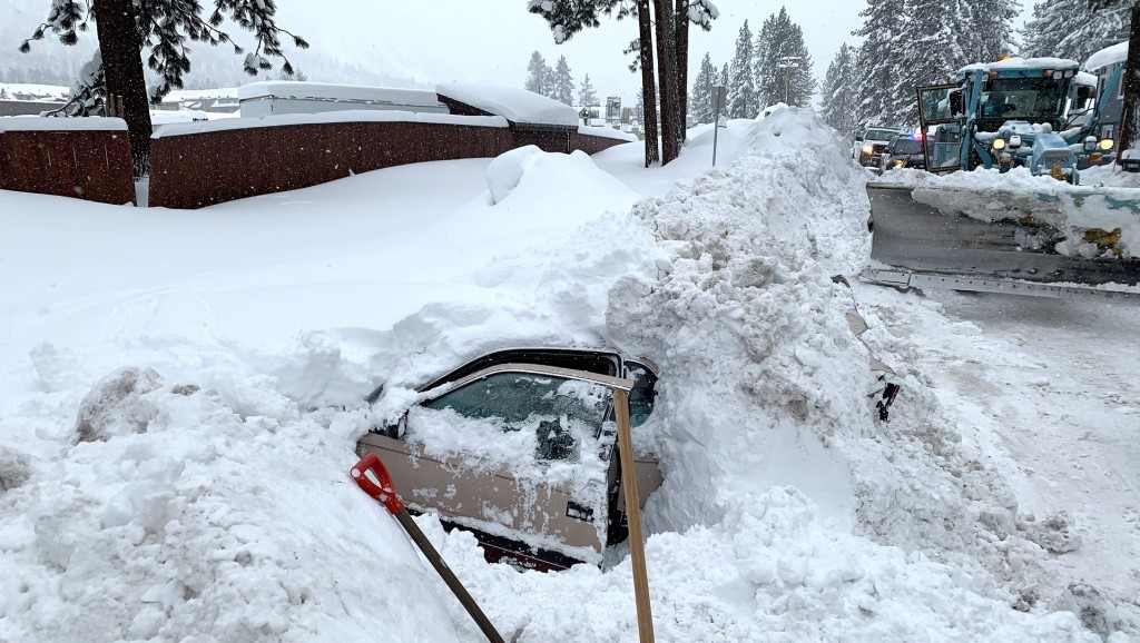 California snowplow driver finds woman alive inside car buried in snow