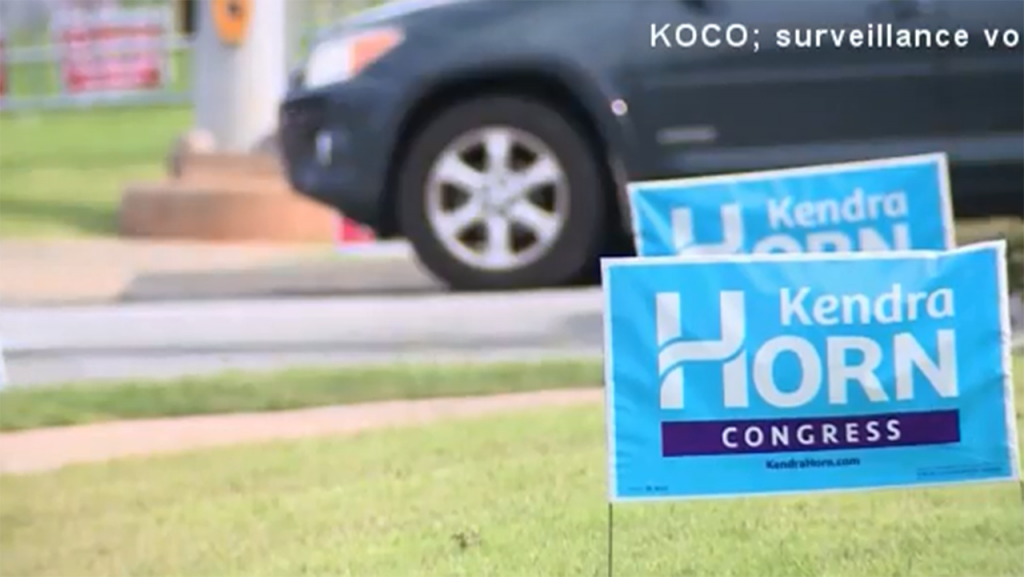 Congressional candidate seen stealing opponent’s campaign signs