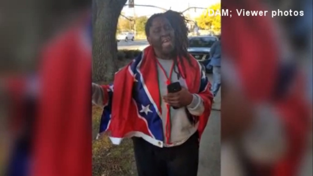 Mississippi woman wears Confederate flag to polls to make point