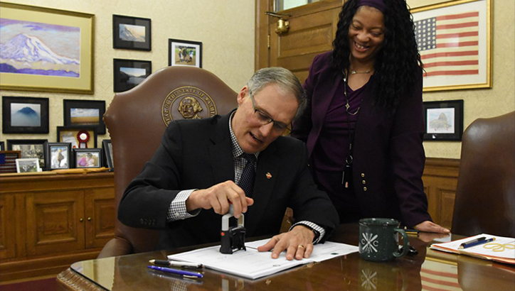 Gov. Jay Inslee signs law aimed at lowering gender wage gap