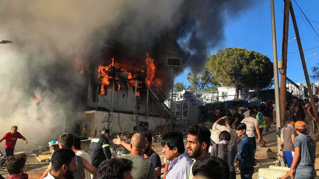 Fatal fire at packed refugee camp sparks riots among residents