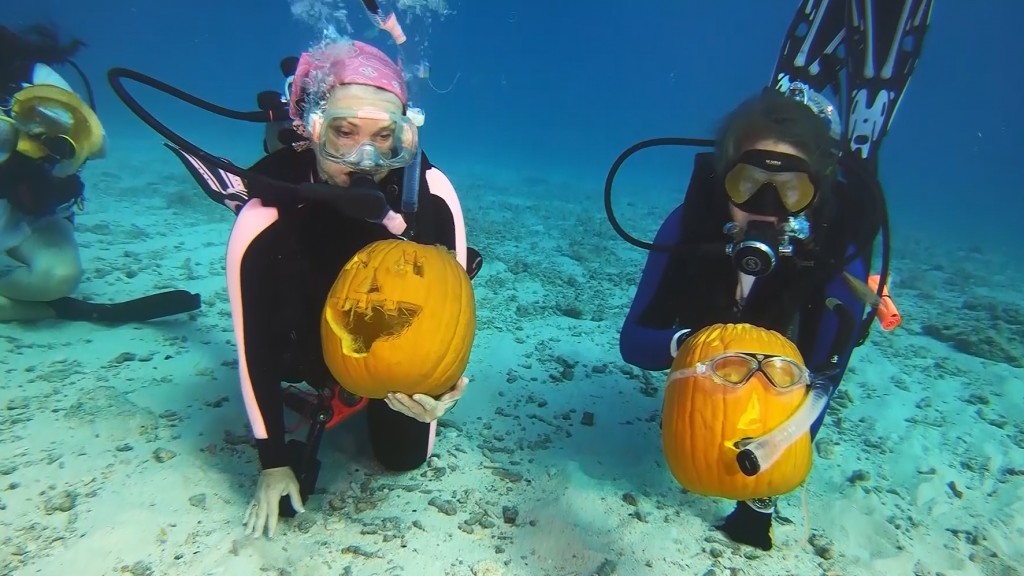 Divers compete in underwater pumpkin carving contest