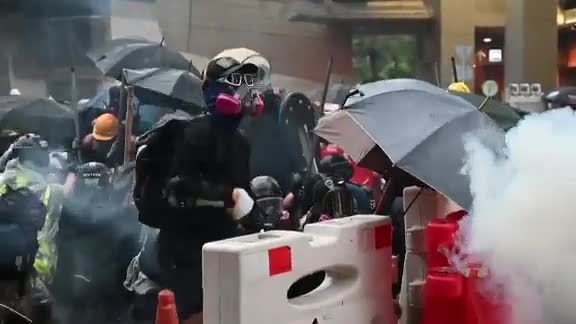 Hong Kong chief executive defends police