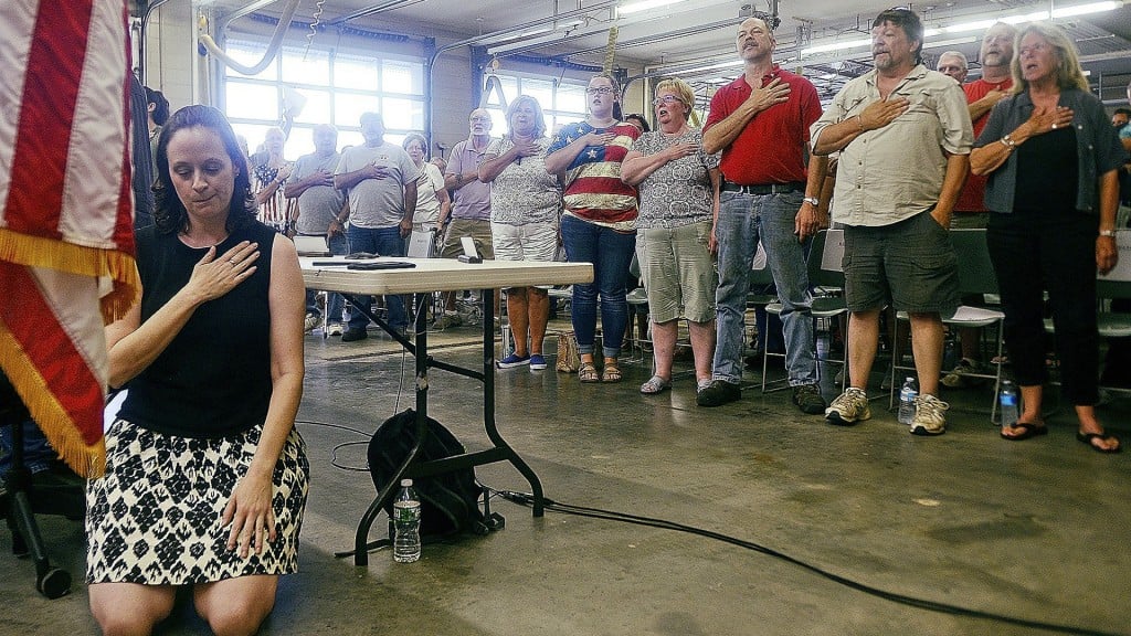 Town official takes a knee during the Pledge of Allegiance
