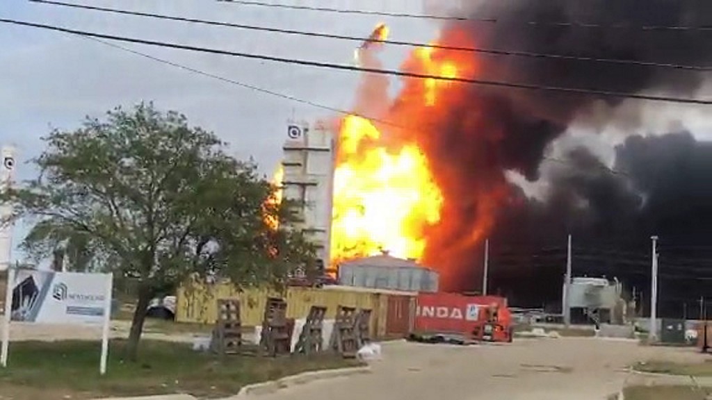 Thousands evacuate as chemical plant continues to burn