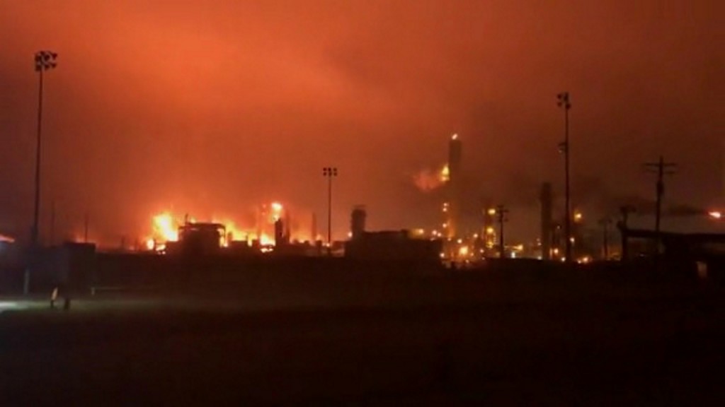 Day after explosions, Texas chemical plant fire continues to burn