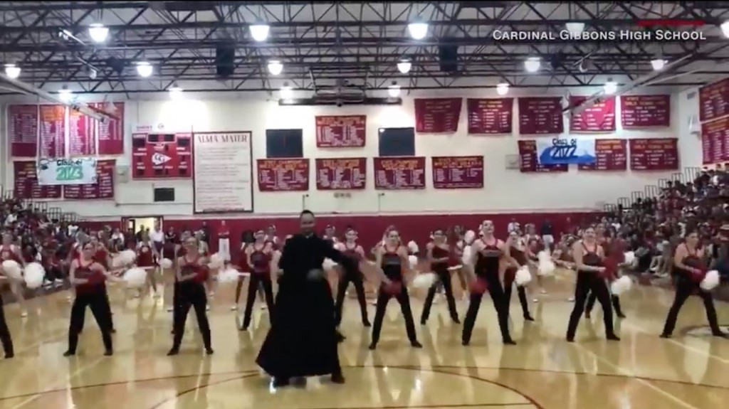 Priest shows off moves at pep rally in Florida