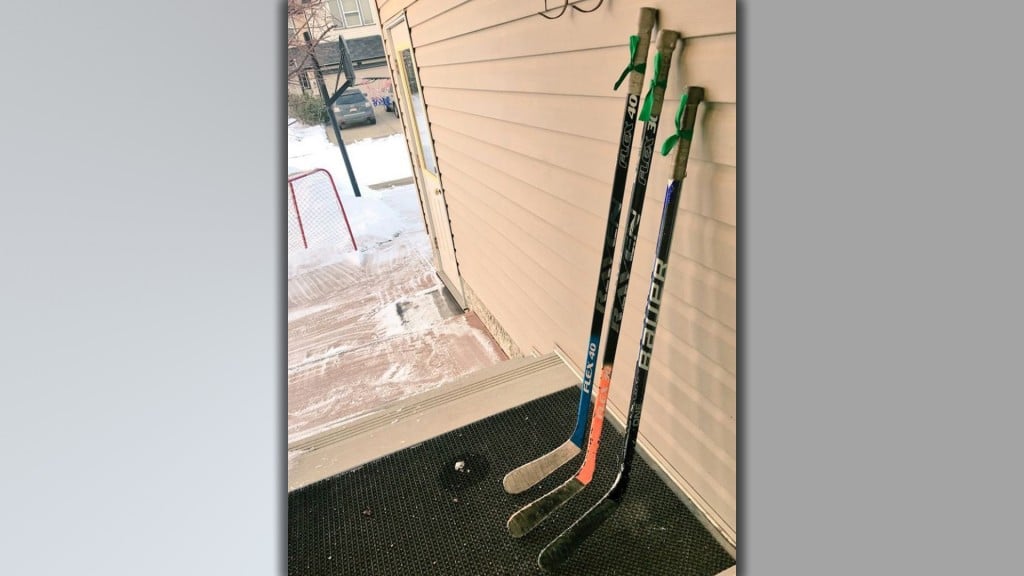 After a devastating bus crash, mourners are paying tribute with hockey sticks