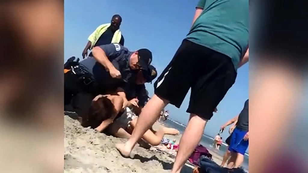 Officer punches woman in New Jersey beach arrest video