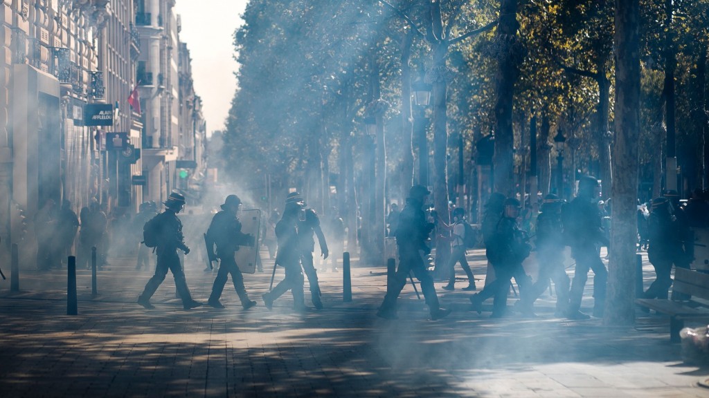 Paris police use tear gas to prevent yellow vest protests