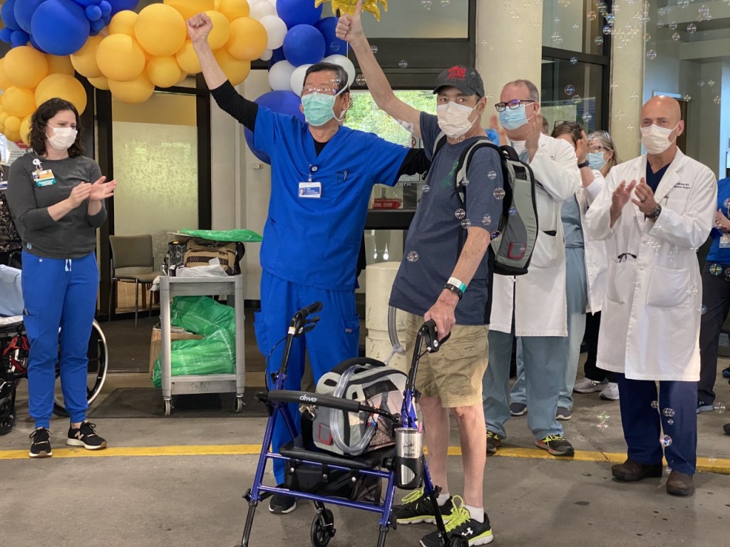 Greg Soumokil leaving the hospital with a Total Artificial Heart
