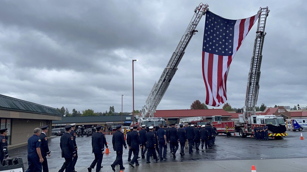 Firefighters Walk Under Ladder With Flag For Spokane Co Fire District 9s Lt Cody Trabers Funeral