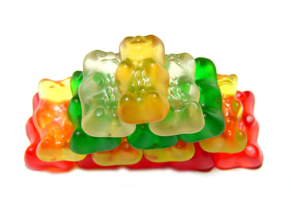 Tower,of,colorful,gummy,bears,candy,on,isolated,white,background